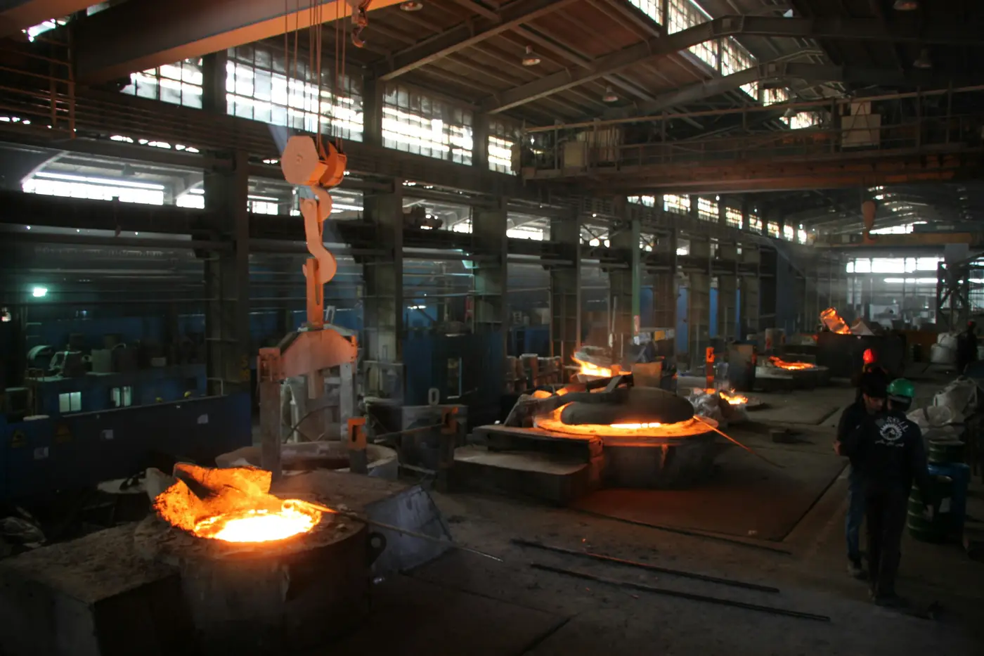 Molten steel being poured inside a steel mill